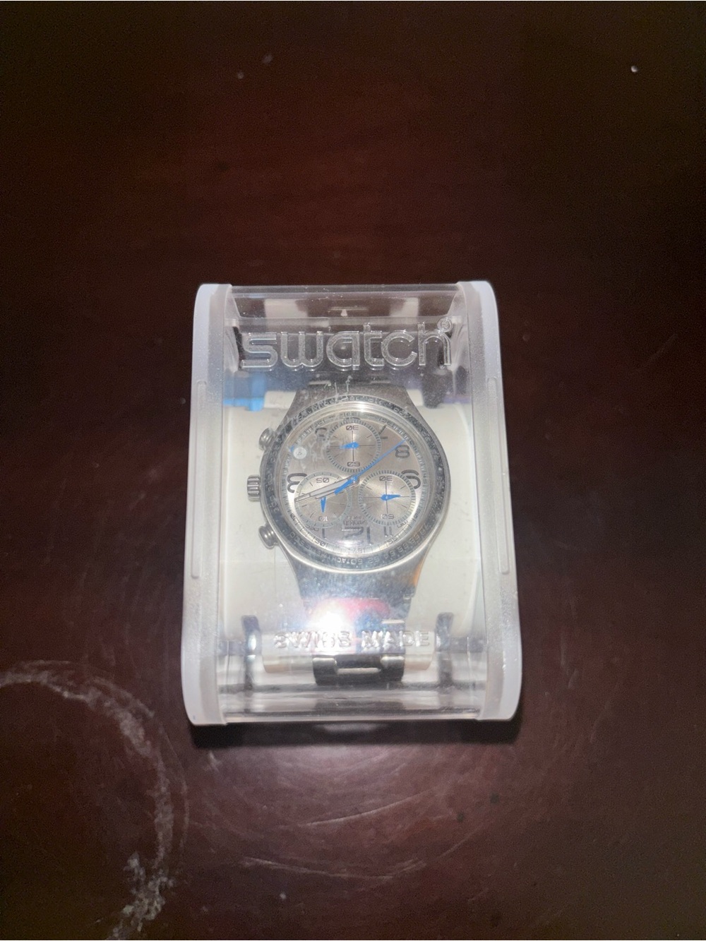 Swatch Silver Watch with Blue Dial Accents